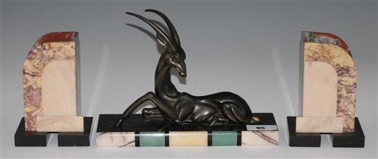 An Art Deco spelter model of an antelope and a pair of marble side ornaments